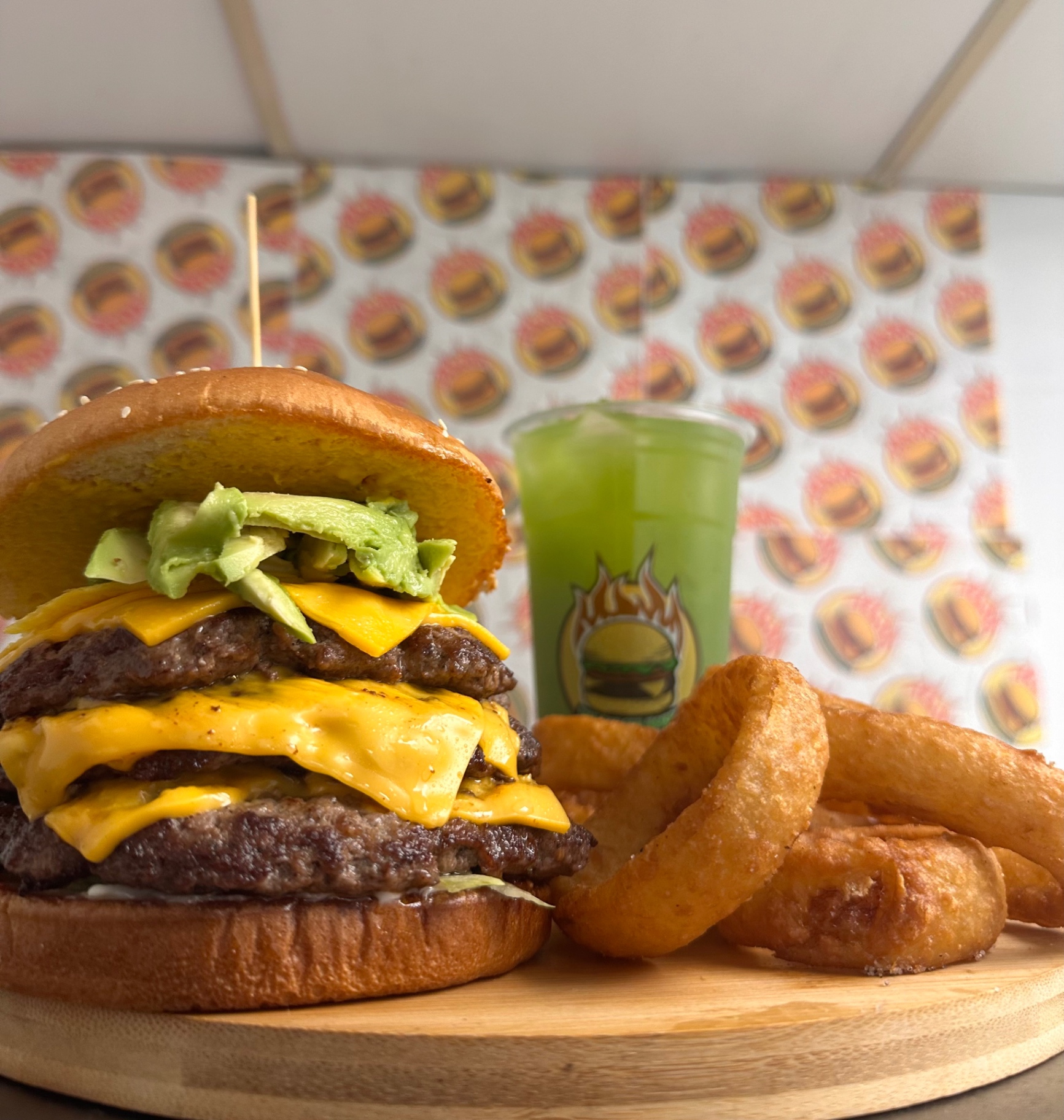 Avocado double cheeseburger combo with onion rings and agua fresca