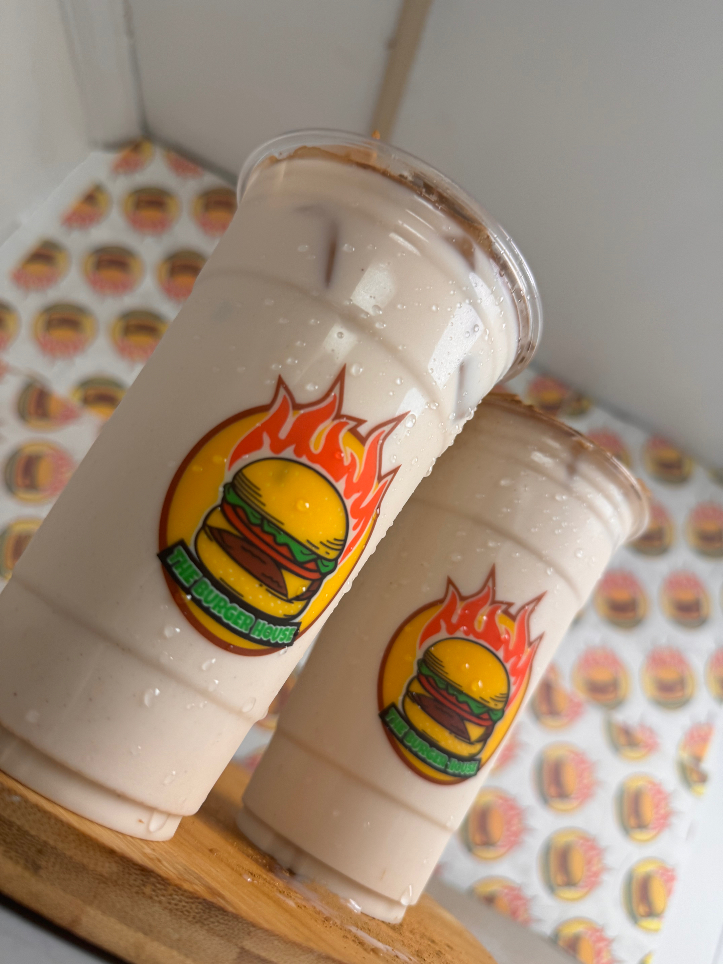 Two large Burger House horchata cups